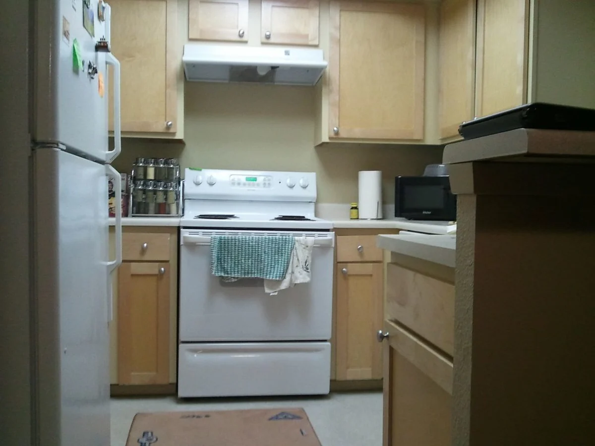 Home kitchen with everyday appliances in a rental apartment