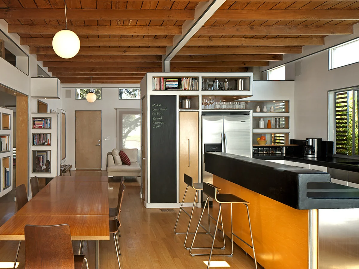Open plan kitchen with dining area in a furnished apartment
